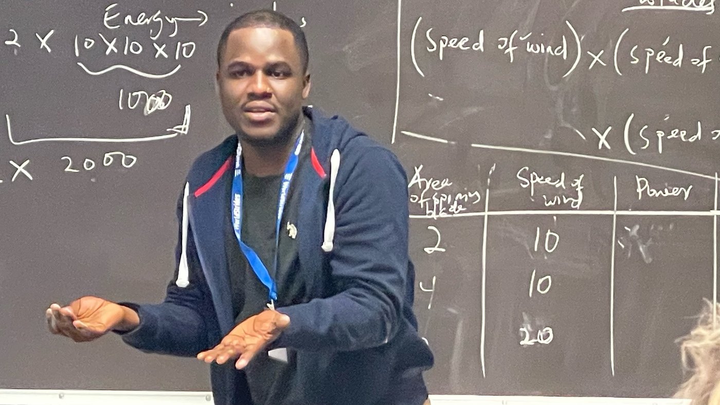 Frederick Senya teaching at the board